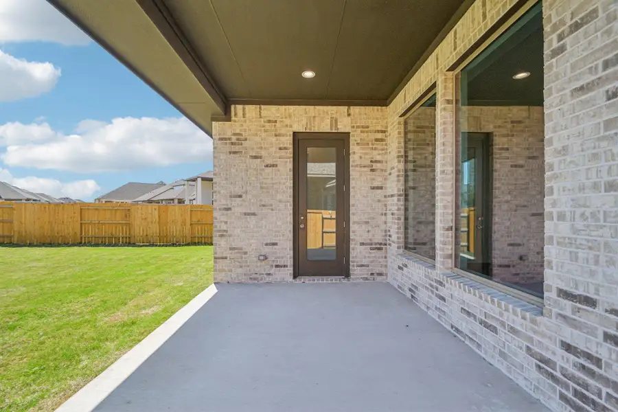 Exterior details and patio area of a home in 6 Creeks, Kyle (Image 18).
