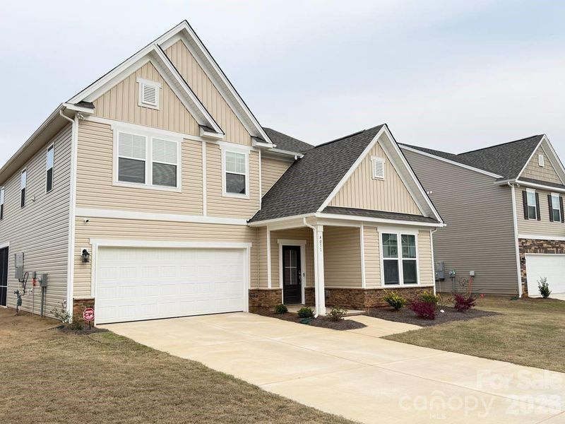 Front exterior of a new home in Clairmont, Charlotte, NC, highlighting curb appeal (Image 1). Front exterior of a new home in Clairmont, Charlotte, NC, highlighting curb appeal (Image 1).