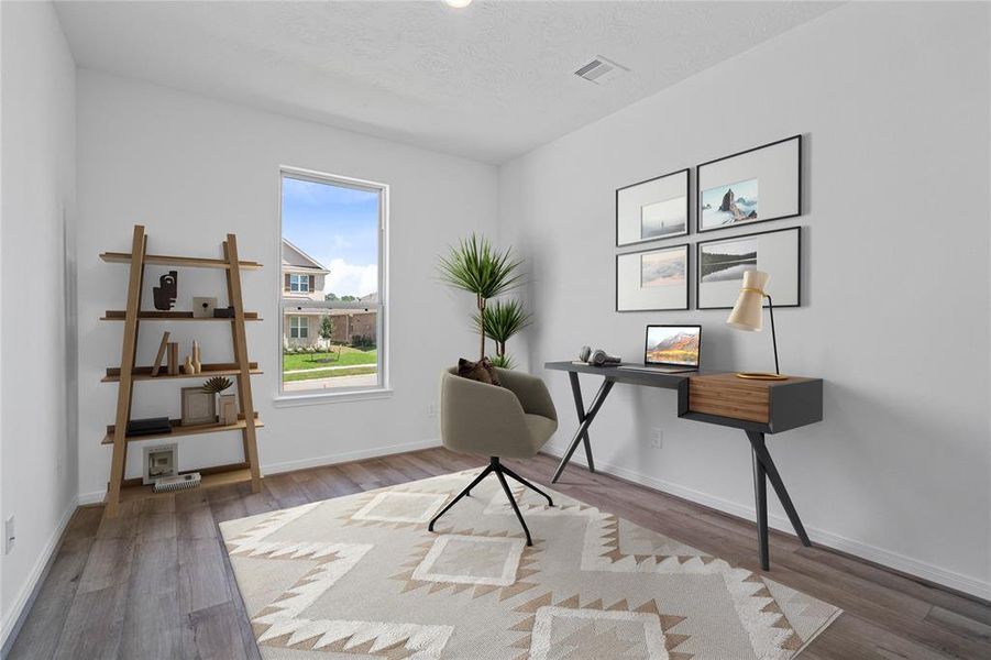 Quietly nestled in front of the home is the handsome den that can be used as an office, play room, dining room, or whatever your hearts desire. Featuring vinyl plank flooring, high ceilings, large windows with privacy blinds and neutral paint.