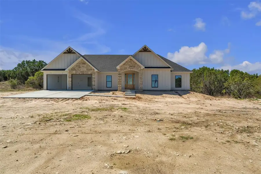 Front exterior of a new home in , Bluff Dale, TX, highlighting curb appeal (Image 6).