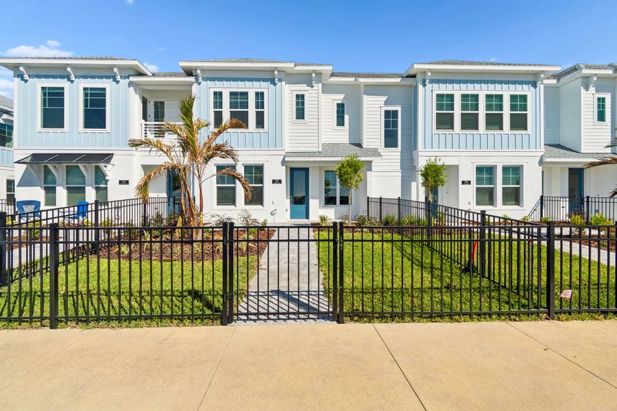 Exterior details and patio area of a home in Emerald Landing at Waterside at Lakewood Ranch – Towns, Sarasota (Image 3).