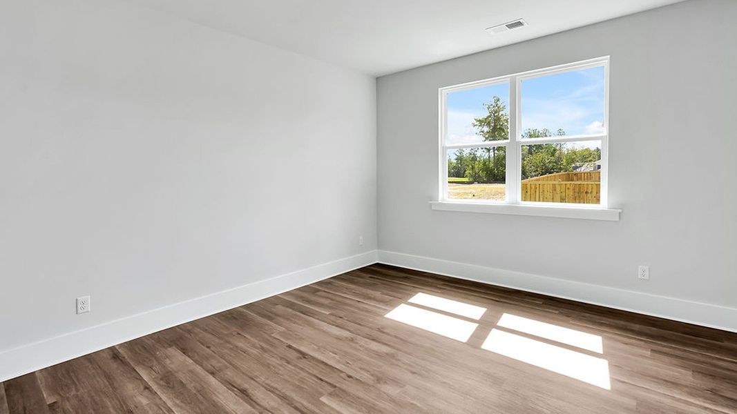 Spacious, unfurnished interior of a new home in The Haven at Indigo Preserve, Leland (Image 23).
