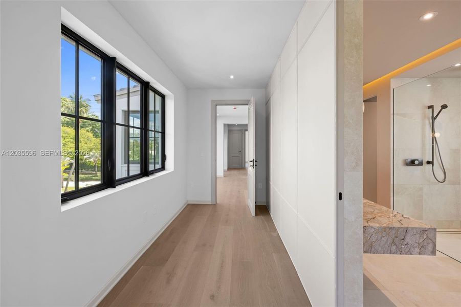 From second floor media room into the primary bedroom From second floor media room into the primary bedroom