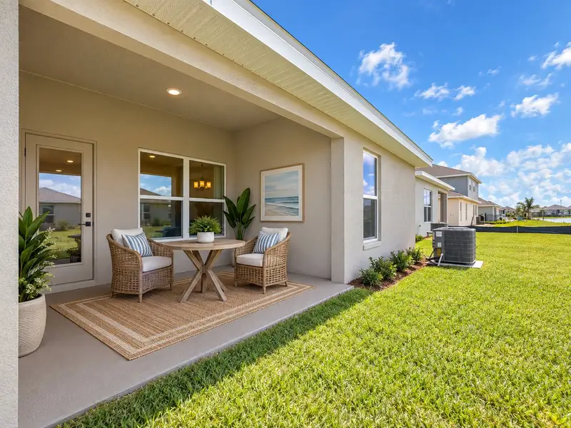 Exterior details and patio area of a home in St. John's Preserve, Palm Bay (Image 3).
