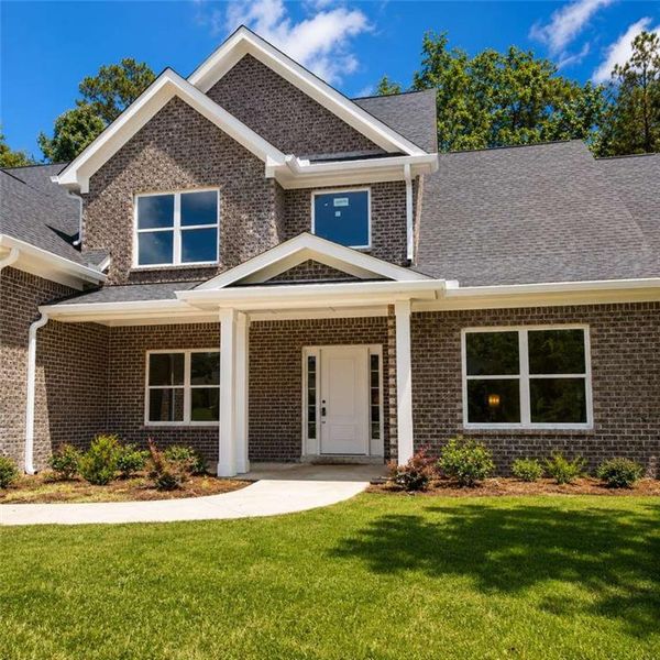 Front exterior of a new home in , Conley, GA, highlighting curb appeal (Image 18). Front exterior of a new home in , Conley, GA, highlighting curb appeal (Image 18).