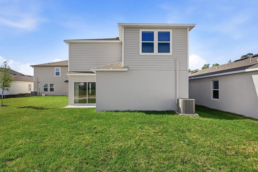 Exterior details and patio area of a home in Palm Wind, Hudson (Image 19).