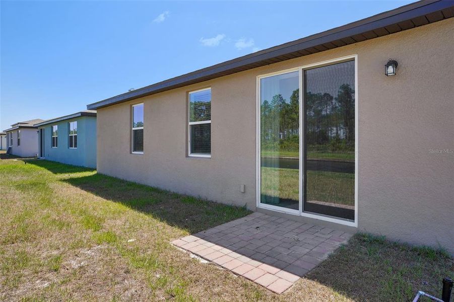 Exterior details and patio area of a home in Lake Deer Estates - Signature Series, Poinciana (Image 4). Exterior details and patio area of a home in Lake Deer Estates - Signature Series, Poinciana (Image 4).