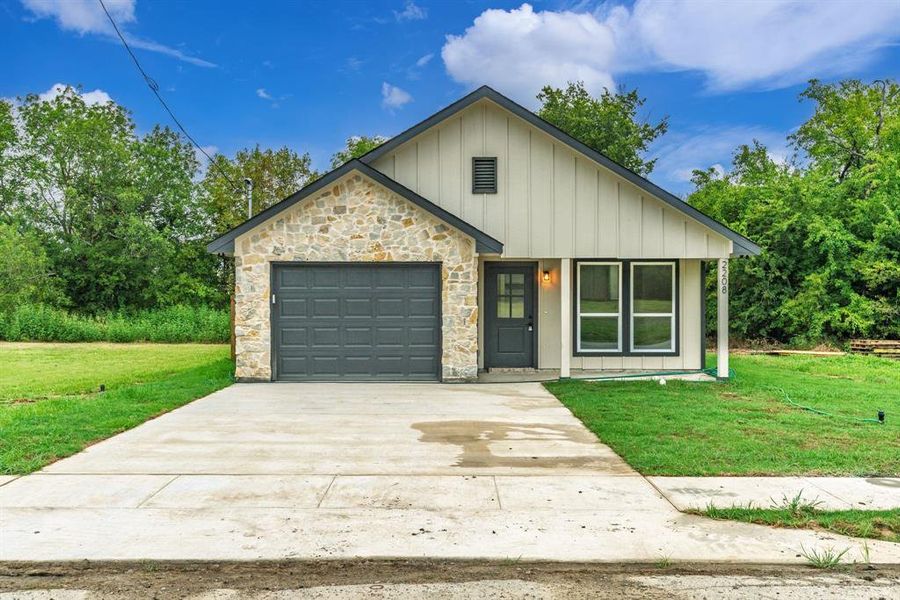 Front exterior of a new home in , Greenville, TX, highlighting curb appeal (Image 22). Front exterior of a new home in , Greenville, TX, highlighting curb appeal (Image 22).