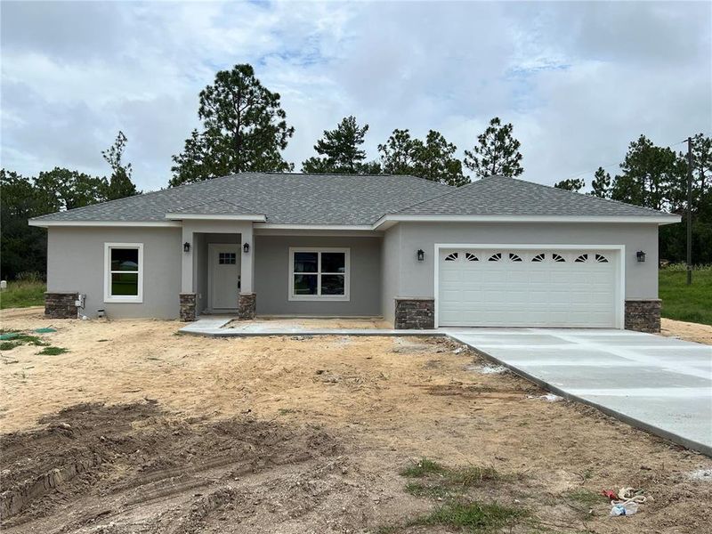 Front exterior of a new home in , Dunnellon, FL, highlighting curb appeal (Image 2). Front exterior of a new home in , Dunnellon, FL, highlighting curb appeal (Image 2).