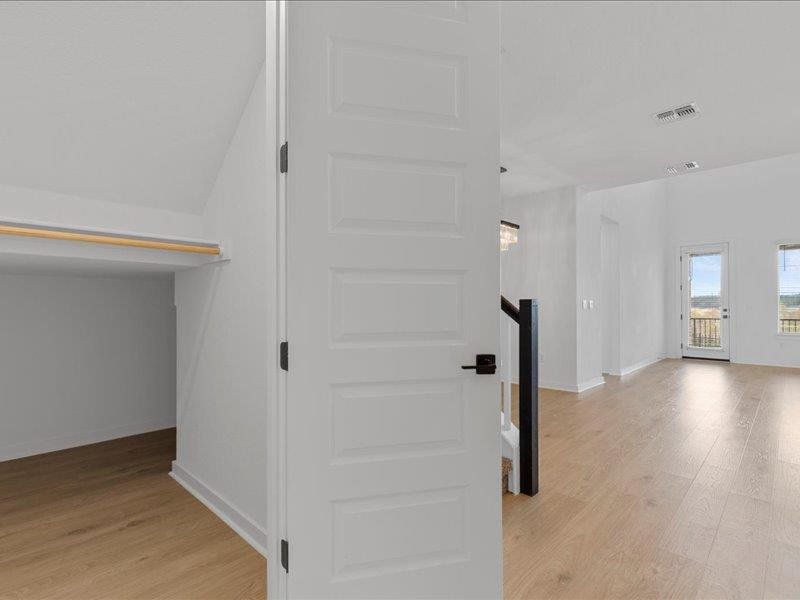 Hall featuring light wood finished floors