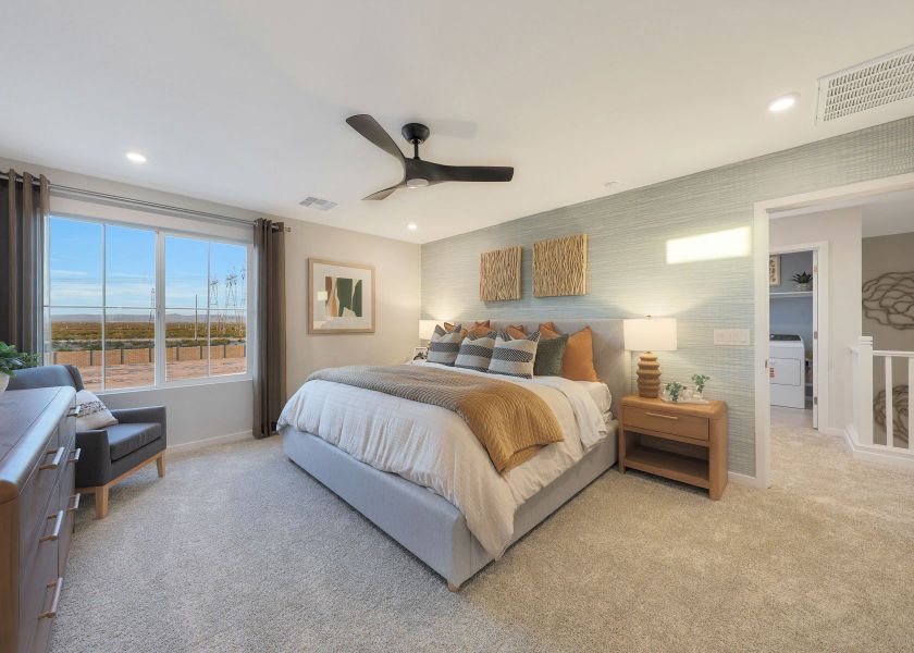 A bedroom with a large bed.