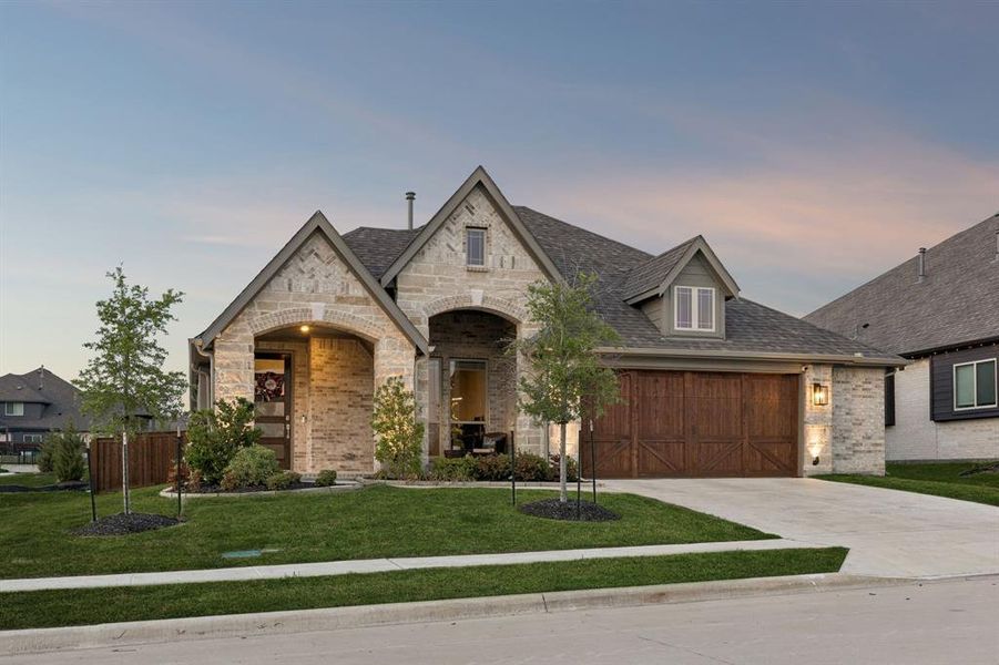 Front exterior of a new home in Devonshire, Forney, TX, highlighting curb appeal (Image 23). Front exterior of a new home in Devonshire, Forney, TX, highlighting curb appeal (Image 23).