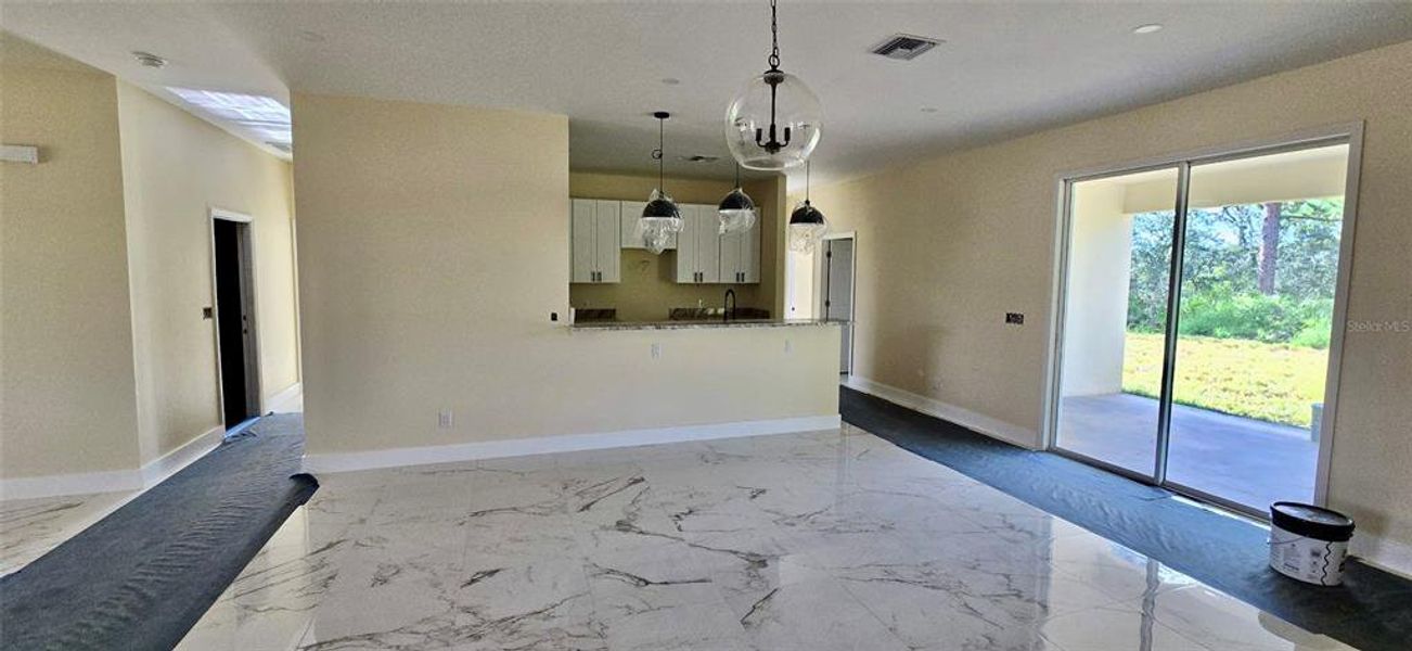 Great Room to open kitchen; doors to covered lania