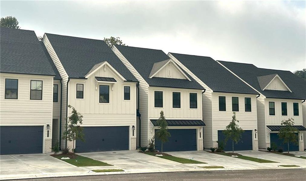Front exterior of a new home in The Reserve at Gainesville Township, Gainesville, GA, highlighting curb appeal (Image 1). Front exterior of a new home in The Reserve at Gainesville Township, Gainesville, GA, highlighting curb appeal (Image 1).