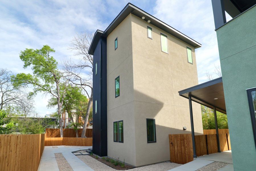 View of property exterior featuring stucco siding and a patio area