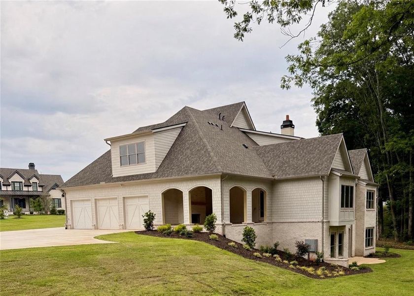 Front exterior of a new home in , Flowery Branch, GA, highlighting curb appeal (Image 7).
