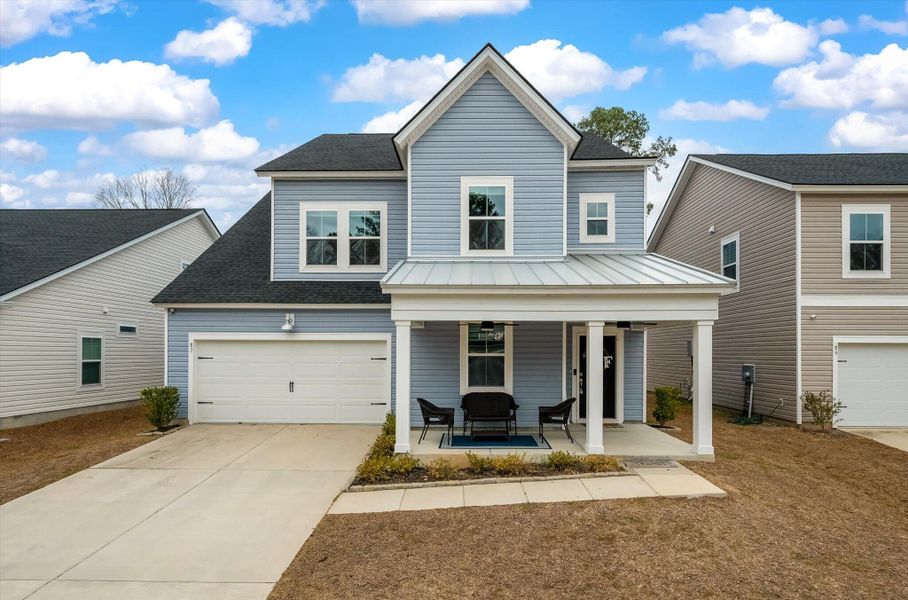 Front exterior of a new home in Limehouse Village: Arbor Series, Summerville, SC, highlighting curb appeal (Image 1). Front exterior of a new home in Limehouse Village: Arbor Series, Summerville, SC, highlighting curb appeal (Image 1).