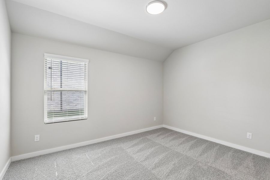 Bedroom in the Oscar home plan by Trophy Signature Homes