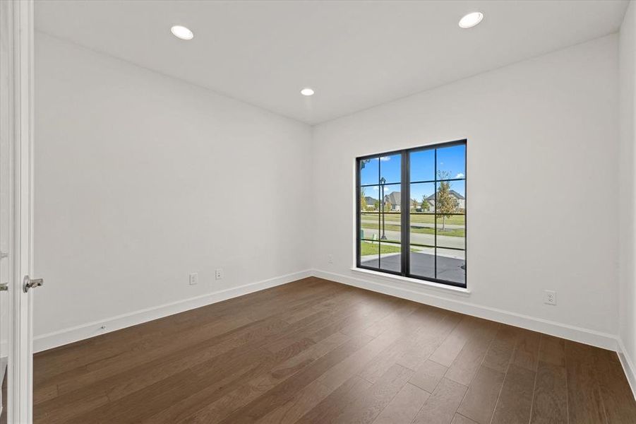 Spare room with recessed lighting and dark wood finished floors