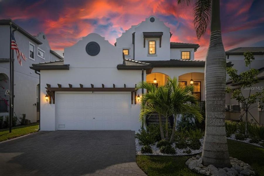 Front exterior of a new home in SouthShore Yacht Club: Somerset Preserve, Ruskin, FL, highlighting curb appeal (Image 1).