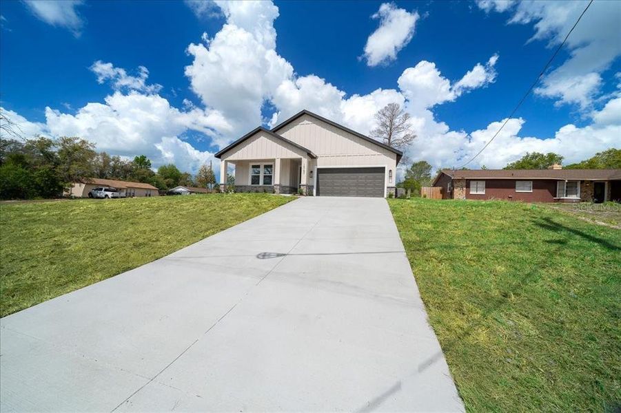 Front exterior of a new home in , Spring Hill, FL, highlighting curb appeal (Image 29).