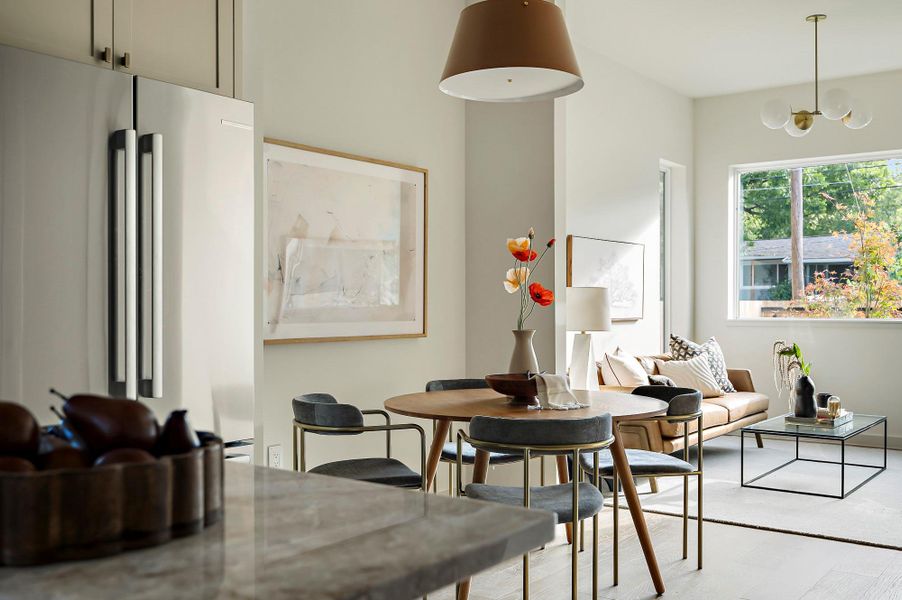 Dining room featuring a chandelier and light wood-type flooring