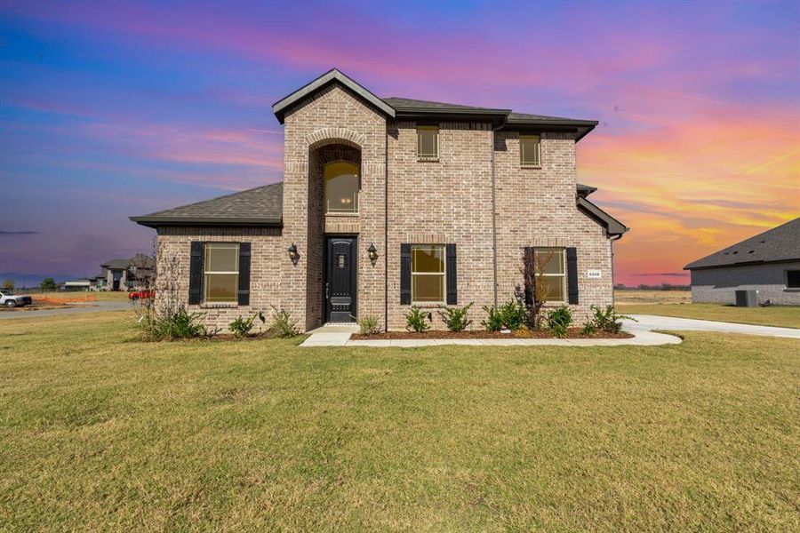 Front exterior of a new home in Stone Henge II, Sanger, TX, highlighting curb appeal (Image 1).