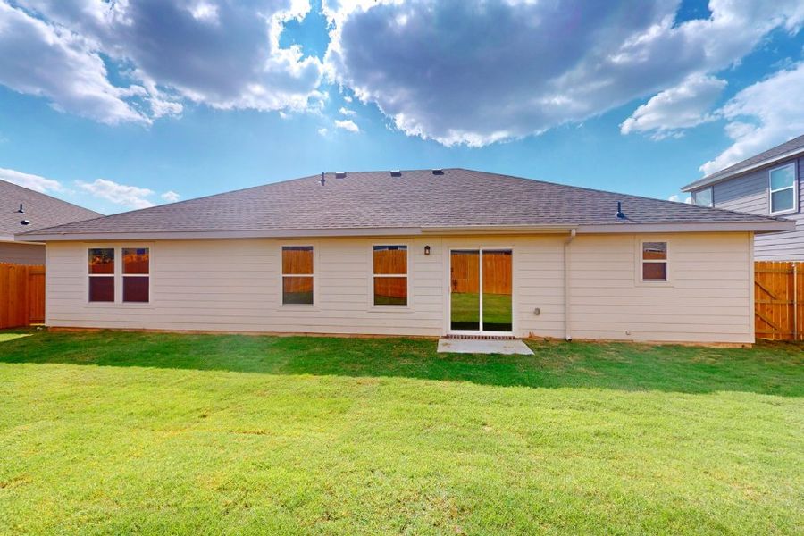 A house with a grass yard. A house with a grass yard.