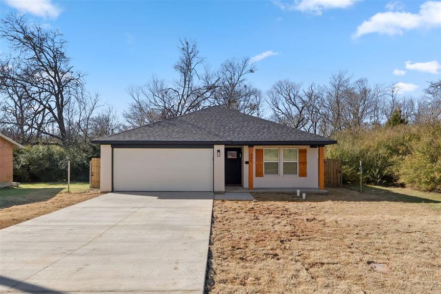 View of front of property featuring a garage