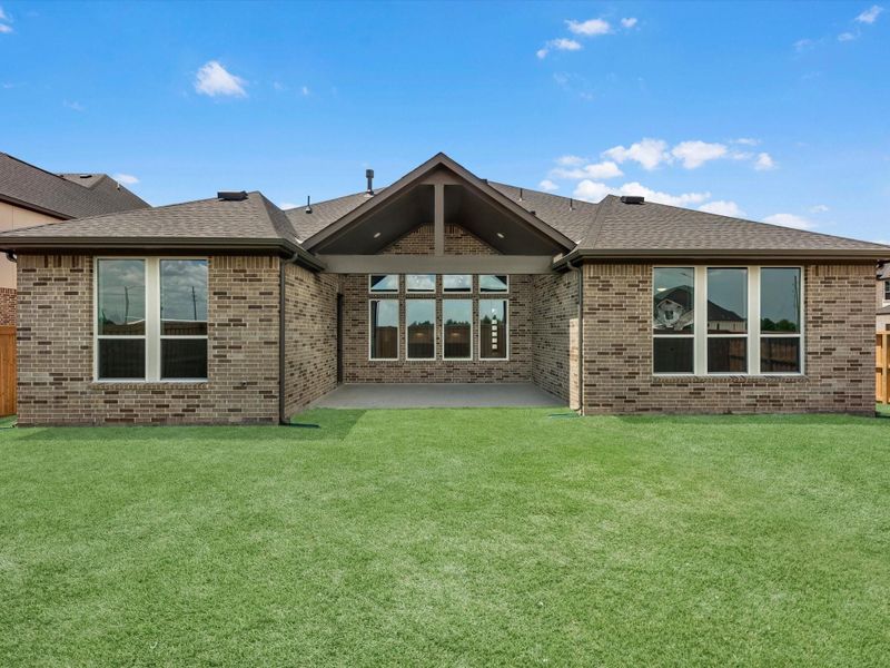 Exterior details and patio area of a home in Dunham Pointe, Cypress (Image 3).