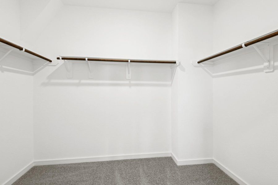 Walk-in closet in the primary suite Walk-in closet in the primary suite