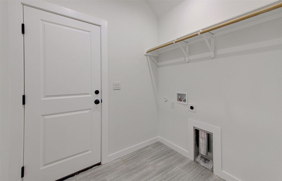 Laundry room featuring hookup for a gas dryer, hookup for a washing machine, and hookup for an electric dryer