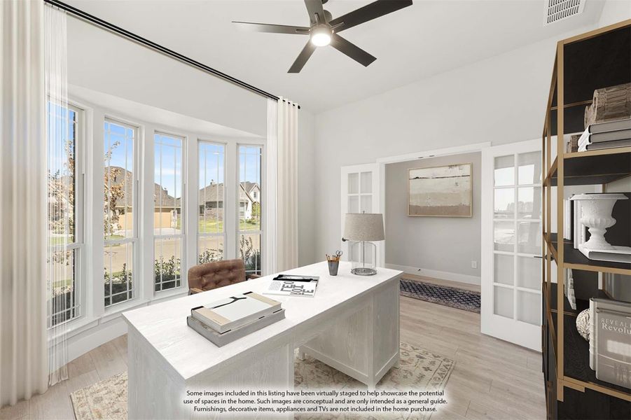 Home office with white desk, ceiling fan, large windows, French doors, and light hardwood floors Home office with white desk, ceiling fan, large windows, French doors, and light hardwood floors
