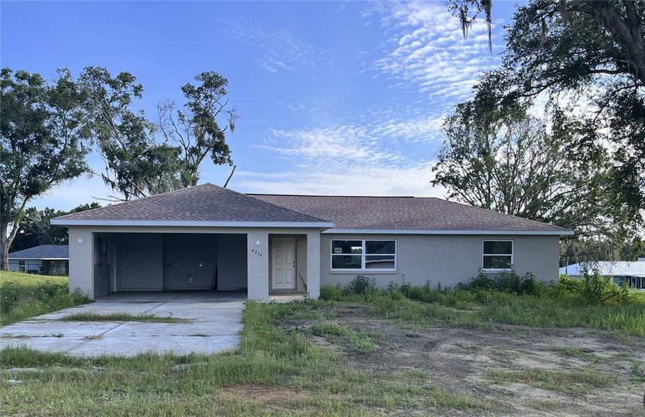 Front exterior of a new home in , Inverness, FL, highlighting curb appeal (Image 2).