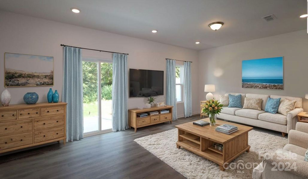 Family room shown with virtually staged furniture