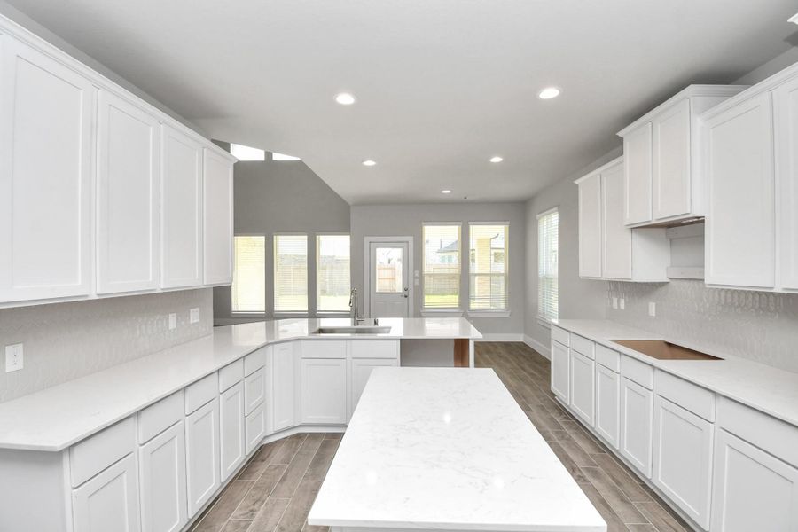 This generously spacious kitchen is a dream realized! Sample photo of completed home with similar floor plan. Actual colors and selections may vary.