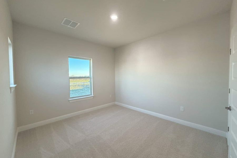 Spacious, unfurnished interior of a new home in The Grove at Blackhawk, Pflugerville (Image 21).