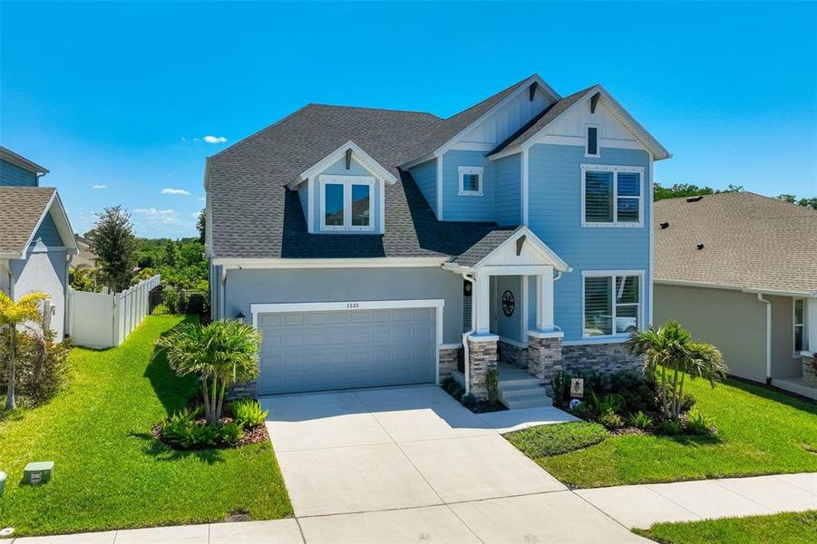 Front exterior of a new home in , Tarpon Springs, FL, highlighting curb appeal (Image 2).
