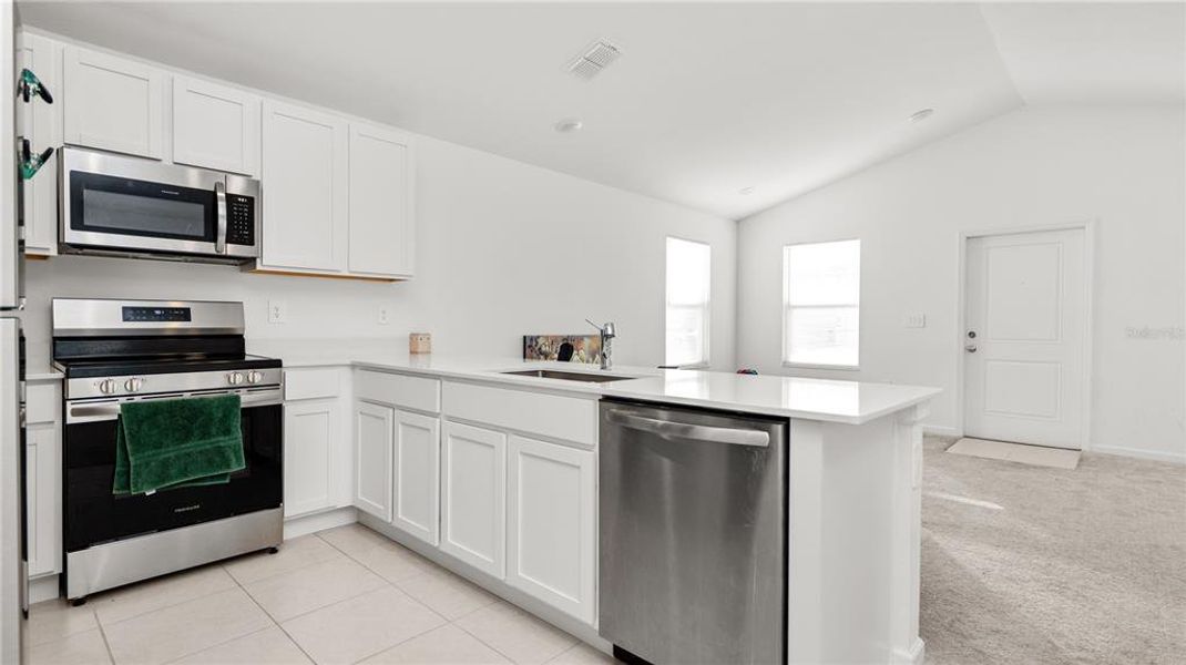 Furnished interior view inside a new home in Peace Creek Reserve: Legacy Collection, Winter Haven (Image 11).