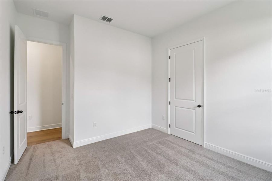 Spacious, unfurnished interior of a new home in Ardisia Park Estate, New Smyrna Beach (Image 12).