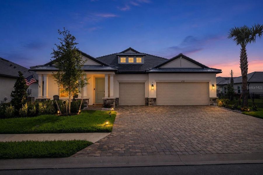 Front exterior of a new home in Sweetwater at Lakewood Ranch, Bradenton, FL, highlighting curb appeal (Image 25).
