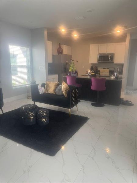 Furnished interior view inside a new home in EverBe, Orlando (Image 2).