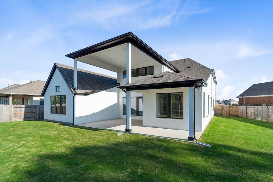 Exterior details and patio area of a home in ARTAVIA, Conroe (Image 26).