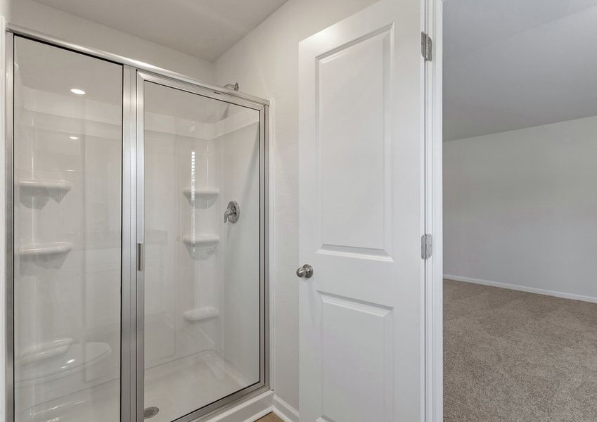 This bathroom has a glass-enclosed shower.