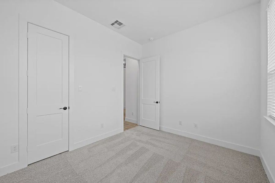 Representative unfurnished interior of a home built from the Summerton by Chesmar Homes in University Heights, Round Rock (Image 17).