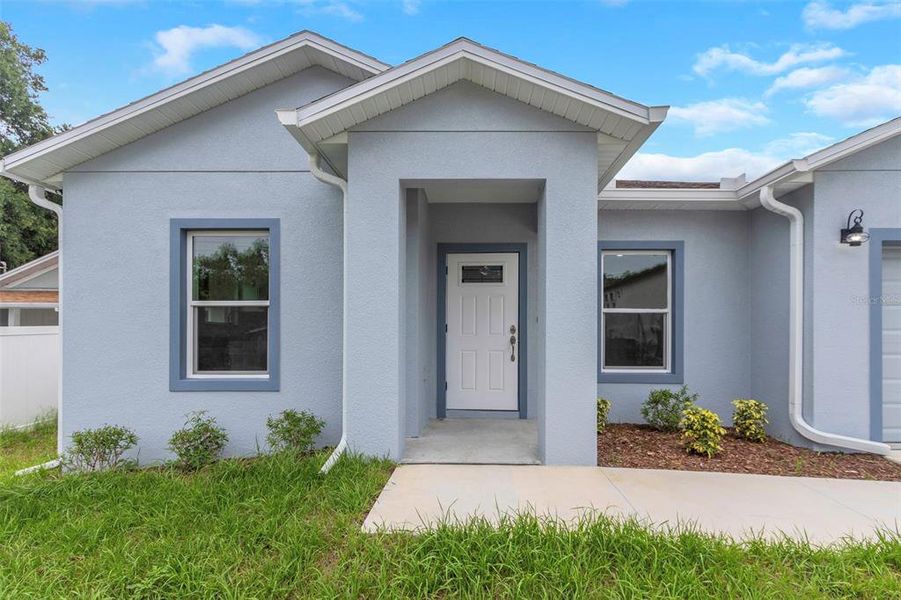 Front exterior of a new home in , Tampa, FL, highlighting curb appeal (Image 2).