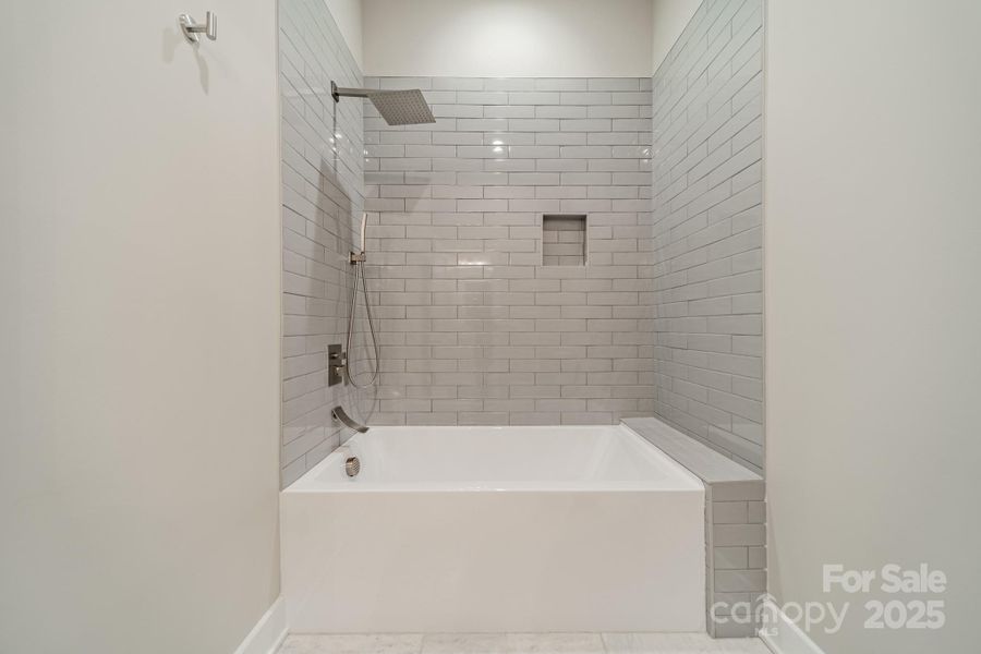 Stunning Full Bathroom for Main Level Bedrooms 1 and 2 with beautiful tilework