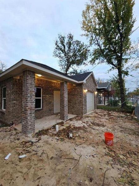 View of side of home with a garage