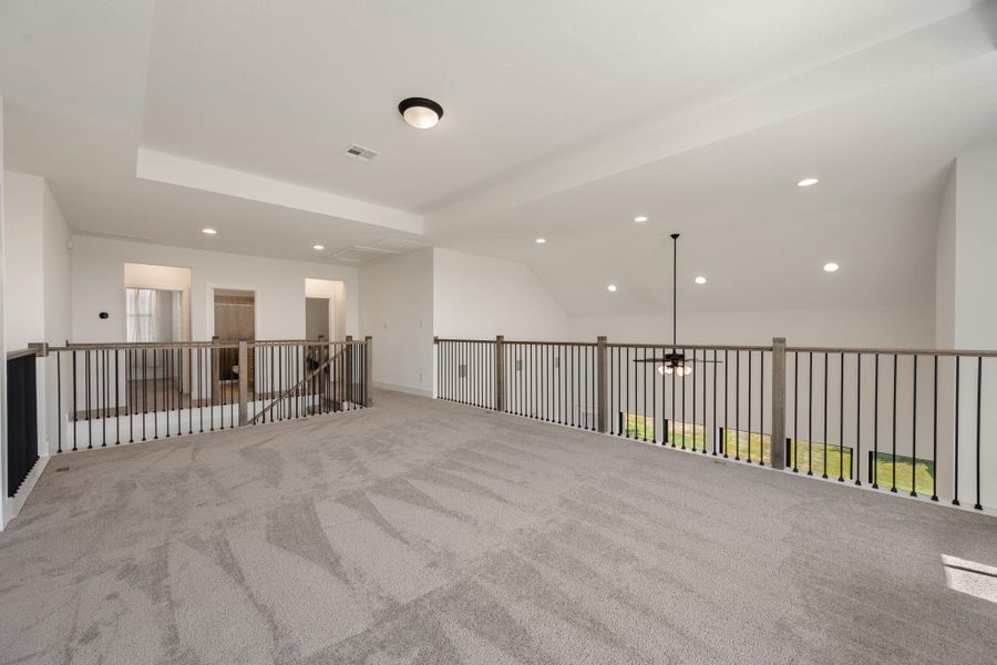 An airy, upper-level loft space offers versatile living with an open view. An airy, upper-level loft space offers versatile living with an open view.