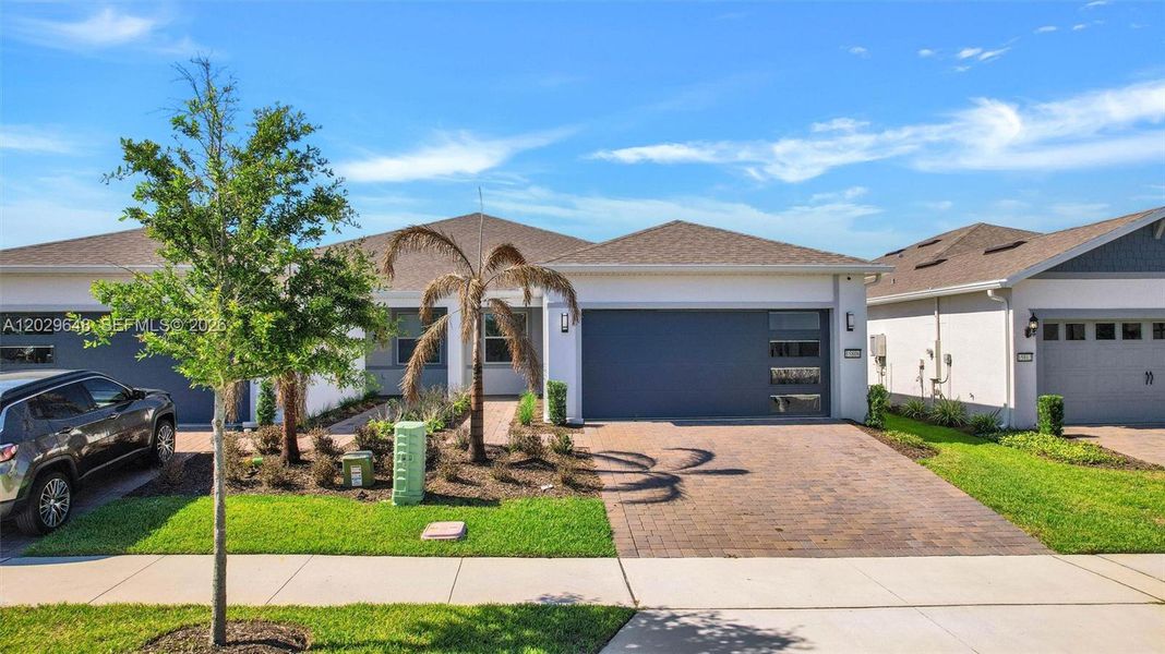 Front exterior of a new home in , Winter Garden, FL, highlighting curb appeal (Image 1). Front exterior of a new home in , Winter Garden, FL, highlighting curb appeal (Image 1).